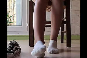 Candid girl feet in white socks