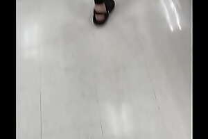Recording Girl with a big ass in green leggings walking in target