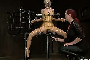 Slave in yellow latex vibrated
