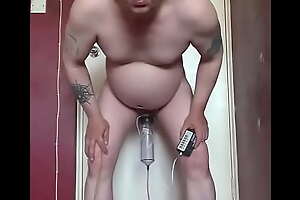 bisexual gay mark wright inserts electro nipple clamps on the end of his cock and takes a piss at the same time filling up his piss tube and covering all the electro wires