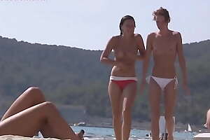Teen beach topless sunbathing